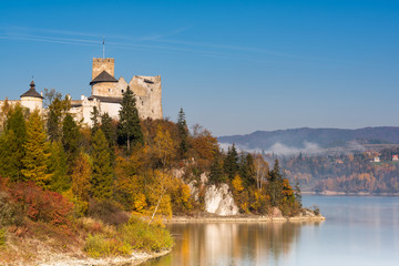 Fototapeta na wymiar Nidzica Castle over lake in Poland
