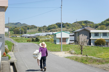 Elderly woman doing agricultural jobs