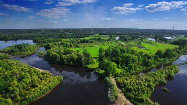 AERIAL Fly over clear blue river and green native forest in middle Europe, Russia, Tatarstan