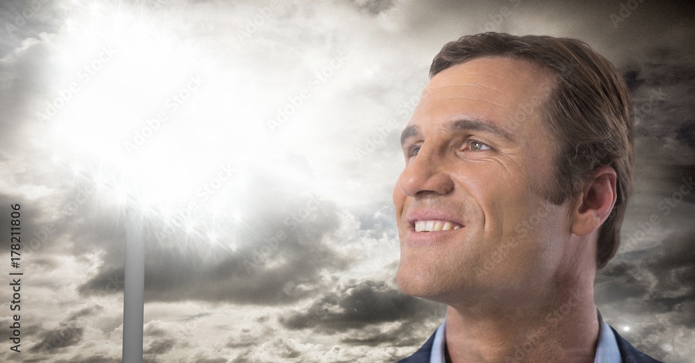 Aufkleber man looking up with stadium lights and clouds background