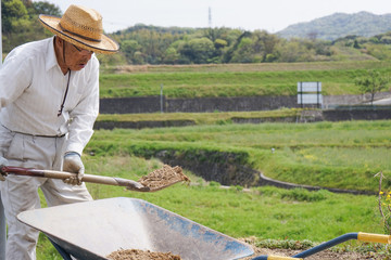 Elderly man doing earth works