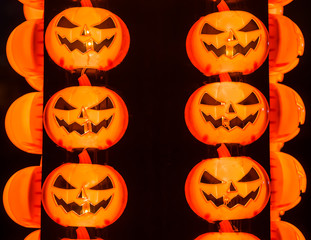 The lining in pattern of the orange growing light pumpkins for Halloween decoration night at the end of October