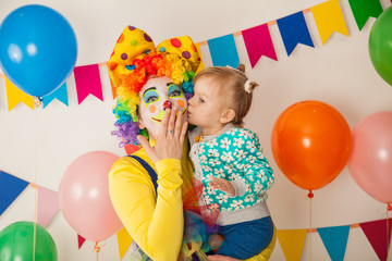 Obraz na płótnie Canvas clown girl and little baby. Celebration. Birthday