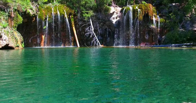 Hanging Lake Waterfalls With Stunning Turquoise Water And Floating Logs - Colorado, USA