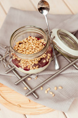 Morning breakfast with pine nuts, jam and yogurt