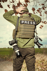 Relax moment for photographer in war conflict field zone 