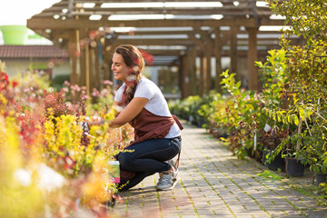 Smiling employee in garden center
