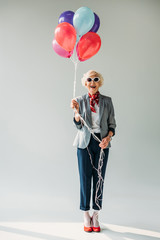 senior lady with balloons