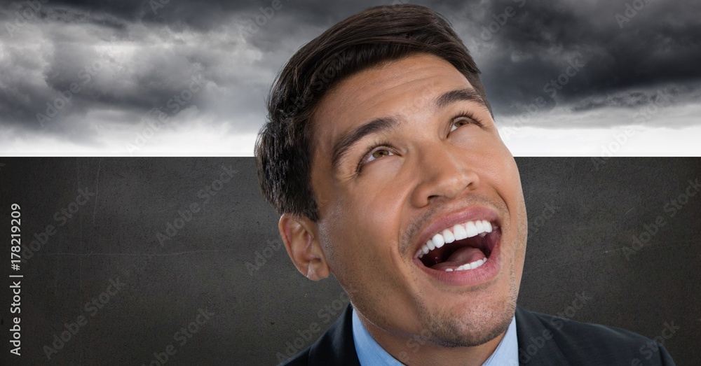 Poster man looking up and laughing with grey background