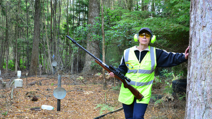 A Lady wearing PPE at a shooting range in the UK.
