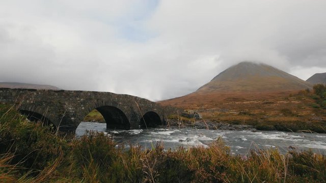 Creek and ancient bridge in mountains, Isle of skye - Scotland, UK