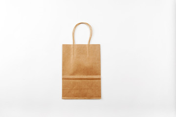 Paper bag with handles on a white background top view