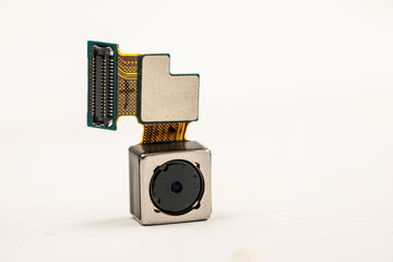 Smartphone camera module on a white background, closeup