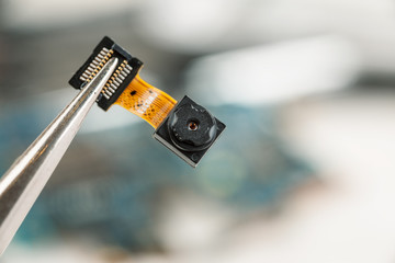 Smartphone camera module in repair shop, macro shot