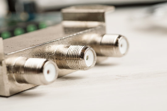 Tv Cable Splitter On A White Table In Repair Shop, Macro Shot