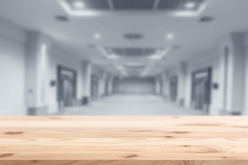 Wood foreground with blur interior modern building background design for display products