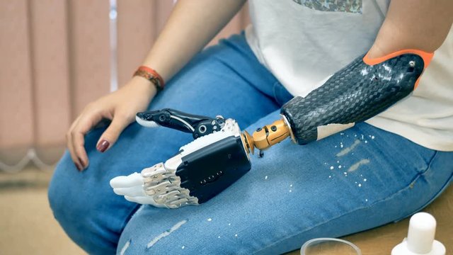 Bionic prosthetic on a human hand. 4K.