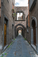 Fototapeta na wymiar Medieval Street with four arches Randazzo, Sicily, Italy