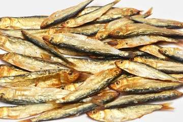 Smoked sprats on white background