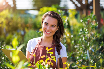 Smiling employee in garden center
