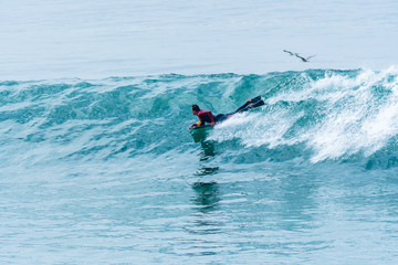 Bodyboarder surfing ocean wave