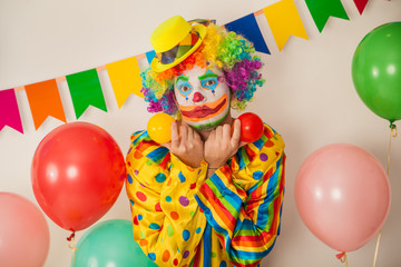 Fototapeta na wymiar Bright cheerful clown. Birthday for children. Human emotions