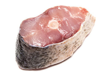 Raw steak of white fish  on white background