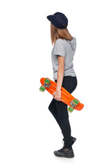 Back view of a teen girl in full length walking holding skate board, isolated on white background