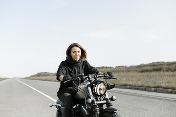 Fototapeta na wymiar Biker Woman on motorcycle