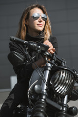 Plakat biker woman sitting on motorcycle