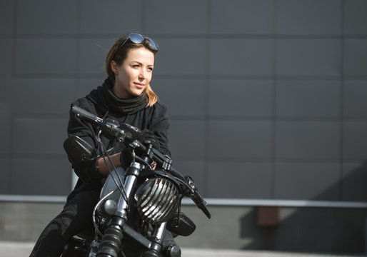 Biker Woman Sitting On Motorcycle