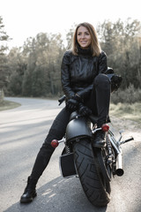 Fototapeta na wymiar Sexy girl biker and cafe racer motorcycle