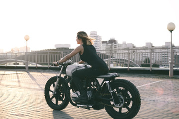 Fototapeta na wymiar Biker Woman on motorcycle