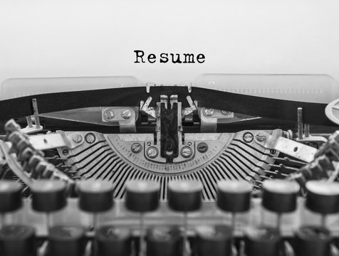 Resume written on an old typewriter concept for job search and recruitment