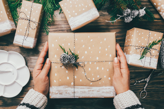 Woman Wrapping Christmas Presents In A Crafty Way