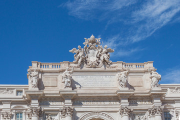 blue sky over the roman monument of trevi fontain, roma italy