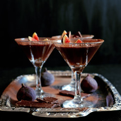 Chocolate mousse dessert with cinnamon, walnuts and figs