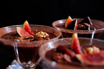 Naklejka na ściany i meble Chocolate mousse dessert with cinnamon, walnuts and figs
