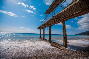 broken pier on the seashore