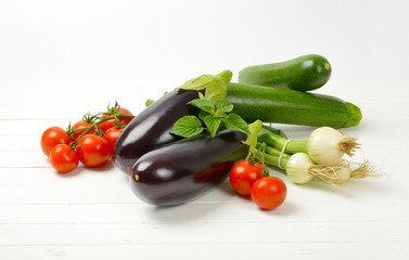 fresh eggplants, tomatoes, zucchini and spring onion