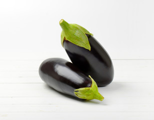 two fresh eggplants