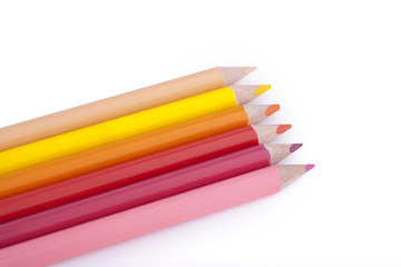 Colorful pencils of yellow-red spectrum isolated on white background