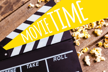 Movie clapper board and pop corn