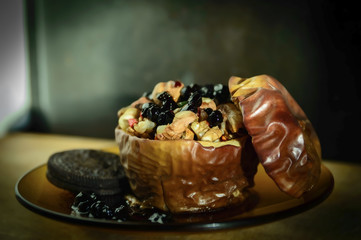 Baked apple with nuts, walnuts and blueberries