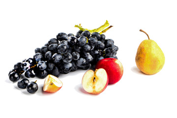 autumnal fruit in basket isolated on white background