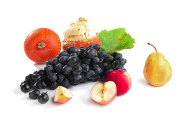 autumnal fruit in basket isolated on white background