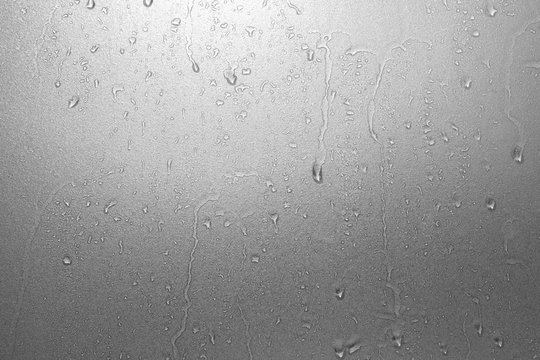 Water drops on frosted glass texture as background