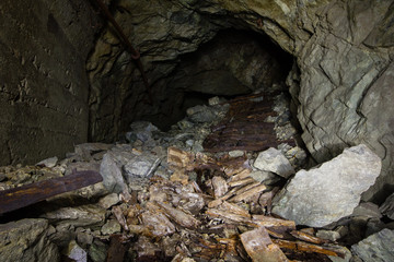 Fototapeta premium Underground abandoned ore mine shaft tunnel gallery collapsed