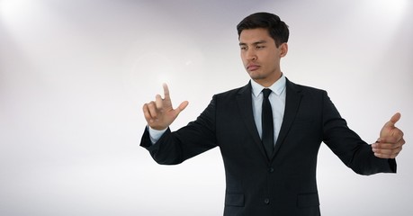 Businessman touching air with hand gestures in front of white