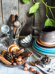 Winter ingredients in a bowl, empty cookware. Rustic style